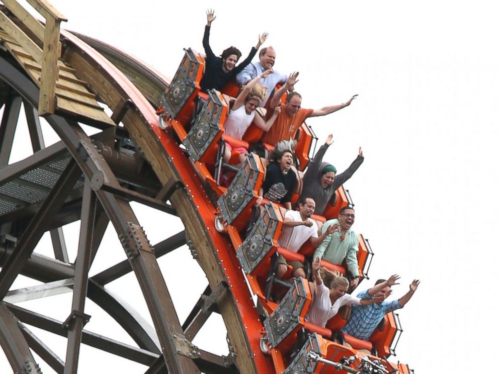 PHOTO: Riders cheer as they experience a vertical drop from the top of Goliath, June 18, 2014.