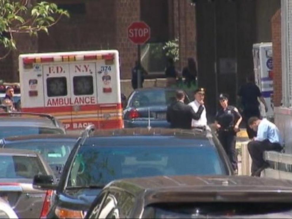 PHOTO: An ambulance sits near the scene of a fatal shooting involving a fugitive in New York City, July 28, 2014.