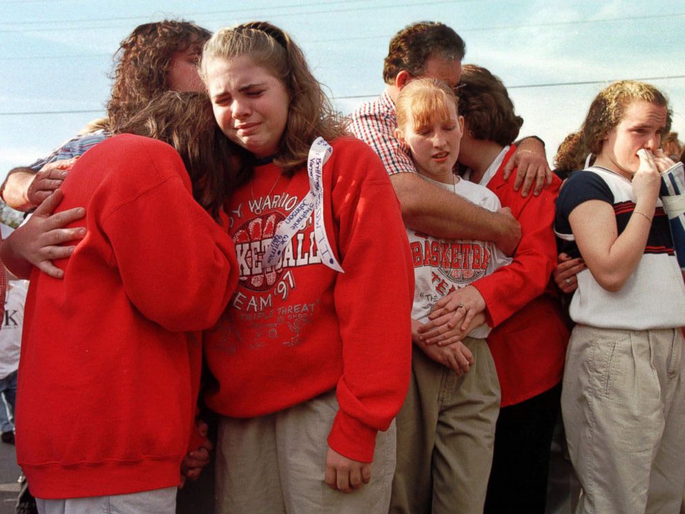 PHOTO: Westside Middle School students gathered in the parking lot of a radio station, March 26, 1998, to hear a tribute song to the children who died in a shooting at the school near Jonesboro, Ark.