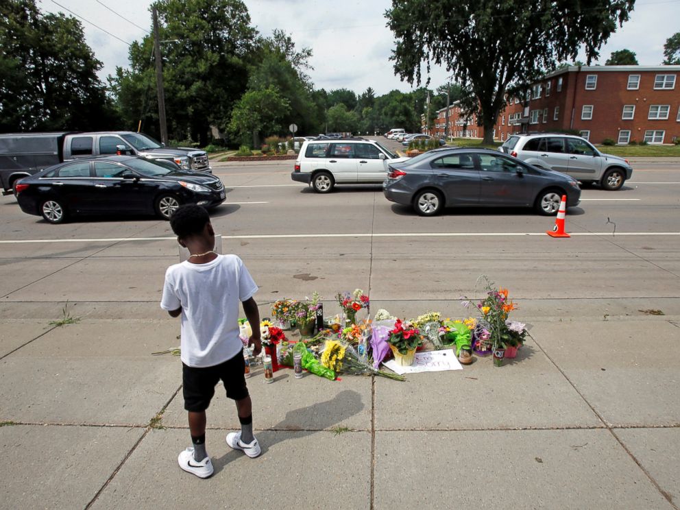 PHOTO: A boy stands at a make-shift memorial at the site of the police shooting of Philando Castile in Falcon Heights, Minnesota, July 7, 2016.