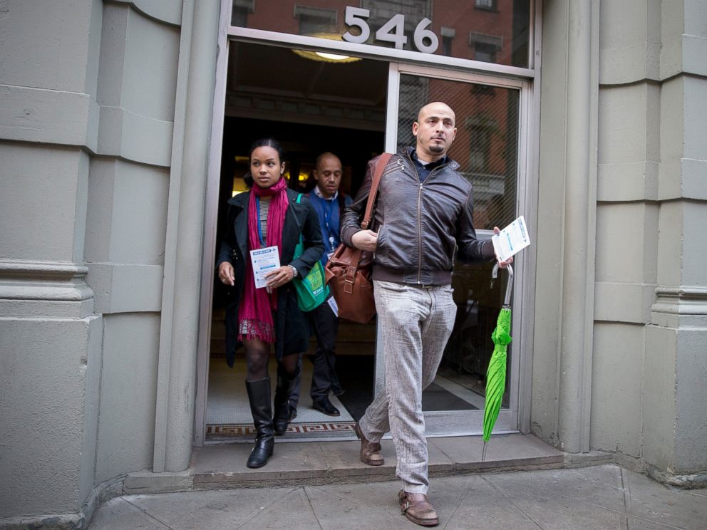 PHOTO: Members of the New York City Department of Health exit the building of a Health Care worker who is suspected to have Ebola in in the Harlem section of New York, Oct. 23, 2014.