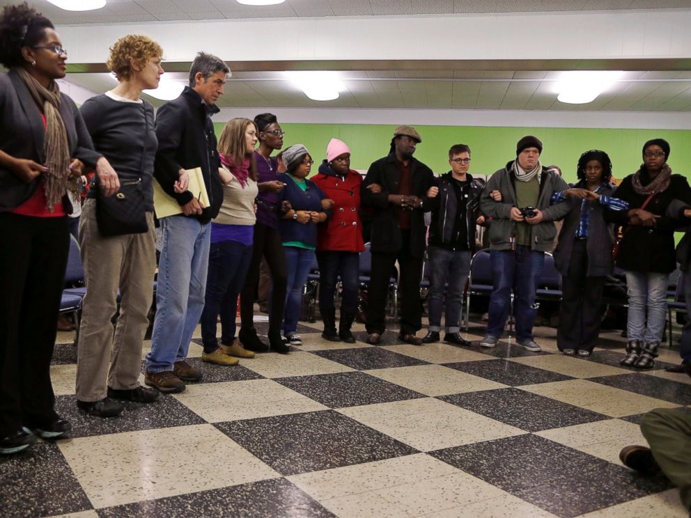 PHOTO: Participants link arms during a training session on how to hold a non-violent and peaceful demonstration, in preparation for the verdict by a Missouri grand jury on the fatal shooting of Michael Brown in St. Louis, Mo., Nov. 12, 2014. 