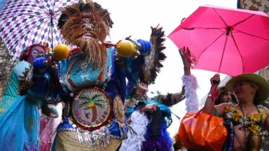 PHOTO: Members of the Mondo Kayo Social and Marching Club parade down St. Charles Avenue on Mardi Gras Day in New Orleans, March 4, 2014. 