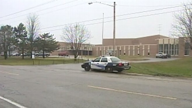 VIDEO: Principal Corry Lambie calmly instructs dispatcher where hostages are located.