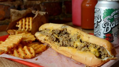 PHOTO: 99 Miles to Philly serves a classic Philly Cheesesteak with Cheese Wiz, and Amoroso Bread, with a side of Waffle fries and rootbeer, New York, Oct. 4, 2012.