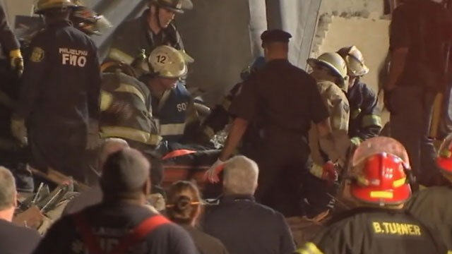 PHOTO: A 14th survivor was pulled from the rubble of a collapsed building in Philadelphia late Thursday night, June 5, 2013. The woman, identified as Myra Plekam, was rushed to the hospital minutes after officials raised the death toll to six people.