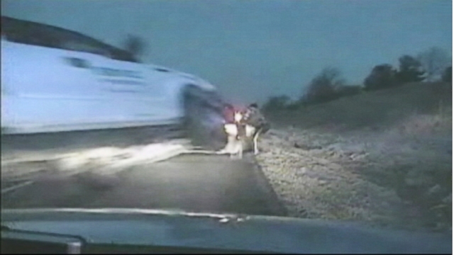 VIDEO: Dash cam footage shows the truck flying between two stopped cars on an Iowa highway.