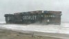 VIDEO: A barge carrying hazardous materials gets stuck on Virginia Beach. 