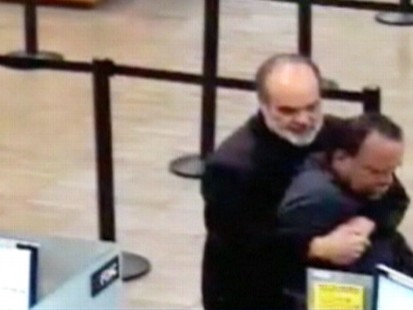 VIDEO: California professor Kim Komenich restrains a bank robber with a bear hug.