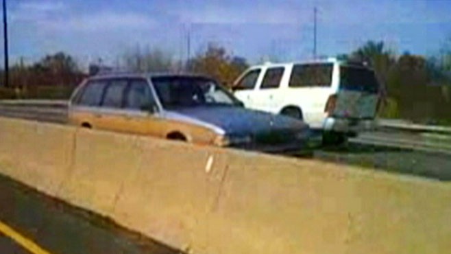 VIDEO: Cell phone camera captures elderly woman driving wrong way on the interstate.