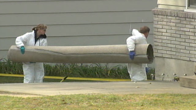 PHOTO: Police search the Kansas City, Mo., home of missing 11-month-old baby Lisa Irwin.