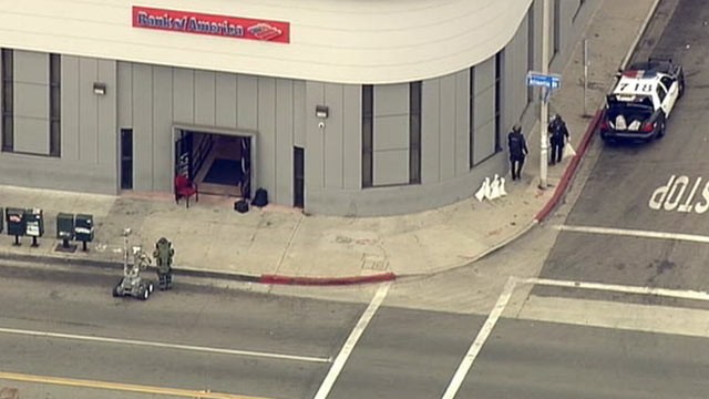 PHOTO: The East Los Angeles Bank of America branch is shown with a sheriff's department robot in front to inspect a device, Sept. 5, 2012.