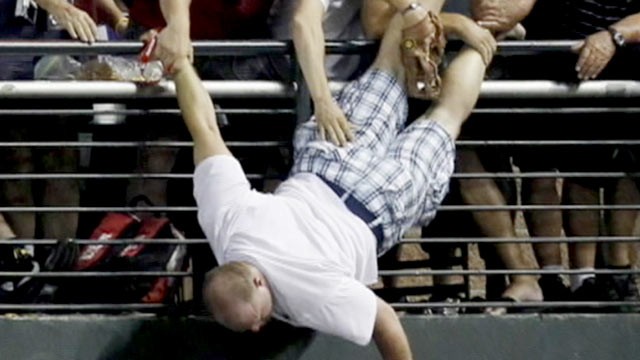 PHOTO: Arizona baseball fan, Keith Carmickle, left, discusses his near death fall while trying to catch a baseball on Good Morning America.