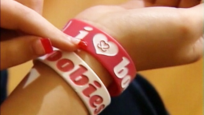 Video: School bans breast cancer awareness bracelets.