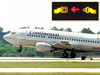 PHOTO A Continental Airlines 737 takes off from George Bush Intercontinental Airport in Houston, Texas in this file photo./Inset: A seatbelt sign is shown in this file photo.