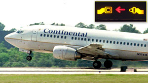 PHOTO A Continental Airlines 737 takes off from George Bush Intercontinental Airport in Houston, Texas in this file photo./Inset: A seatbelt sign is shown in this file photo.