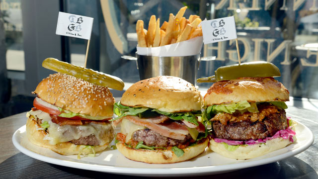 PHOTO: DBGB's restaurant offers a "menage à trois" Burger dish, including 3 different burgers, The Yankee, The French and the Piggy, New York City, July 25, 2012.