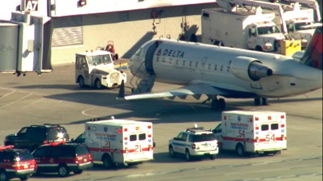 PHOTO: A Delta flight was under quarantine at Chicago Midway Airport, April 26, 2012. Police and paramedics surrounded the plane on the tarmac.