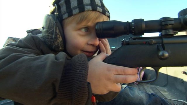 PHOTO: Four-year-old Gage Butler aiming his .22-caliber rifle. The Butlers have been shooting guns for generations.