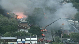 PHOTO High winds are fueling fires burning at dozens of homes in multiple neighborhoods throughout the city of Detroit.