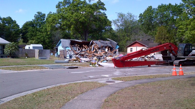 PHOTO: Crews demolished a Florida home over a massive sinkhole, where one man was swallowed by the earth.