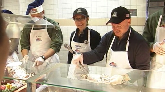 VIDEO: Gabrielle Giffords and husband Mark Kelly help out at Arizona military base.