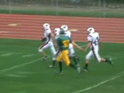 VIDEO: A teen with Down Syndrome scores a touchdown during a high school game.