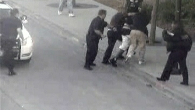 PHOTO: Homeless man saving police officer
