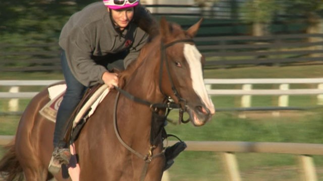 PHOTO: Vanessa Reill, 22, races a thoroughbred horse down the dirt track at the North American Racing Academy in Lexington, Ky.