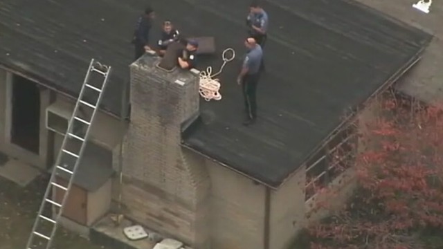 VIDEO: Georgia police take teen stuck in chimney for more than 10 hours into custody.