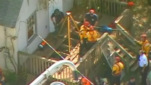 PHOTO: Emergency workers search for Baby Lisa Irwin in a well under a deck behind a vacant home in Kansas City, Mo., in this photo taken from aerial footage, Oct. 11, 2011.