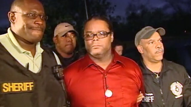 PHOTO: Lyndon Granger, brother of courthouse shooting suspect Bartholomew Granger, is arrested during a Houston news conference about the shooting.