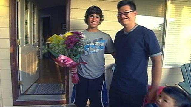 PHOTO: Marcos Ugarte, 14, left, greets Alex Ma, the father of the young boy he saved from a burning home in Troutdale, Ore.