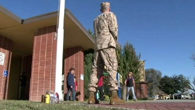 PHOTO: Marine Sgt. Craig Pusley stood outside of Hughson Elementary School in Hughson, Calif.