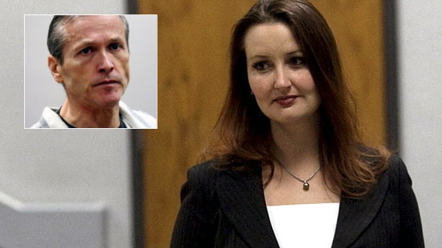 PHOTO: Gypsy Willis, right, passes defendant Martin MacNeill, a doctor accused of murdering his wife, in Provo, Utah during a preliminary hearing, Oct. 10, 2012.