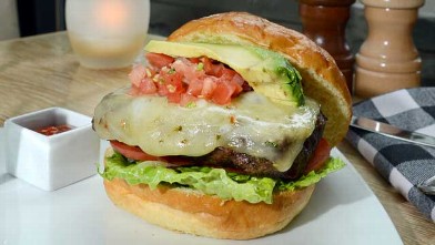 PHOTO: The Southwestern Burger is a great splurge option at MARX restaurant, served with truffle parmesan french fries and blueberry cocktail, July 20 2012.