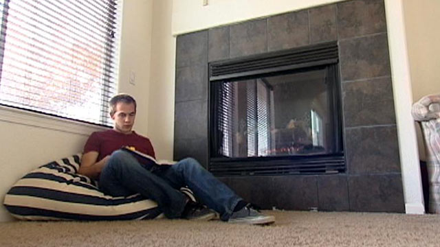 PHOTO: Third-year University of California, Merced student Jeff Laird studies by the fireplace in a McMansion he shares with five other engineering students.