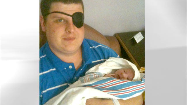 PHOTO: Mitchell Johns holds his son, Kaden. Johns and his wife, Amanda, were seriously injured when a tornado destroyed their house, in Alabama. Amanda was five months pregnant with Kaden.