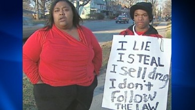 PHOTO: Dynesha Lax is making her son wear a sign that lists his numerous run-ins with police.