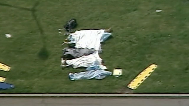 PHOTO: The bodies of victims lay outside of Oikos University in Oakland, Ca. where as many as eight people may have been shot, April 2, 2012.