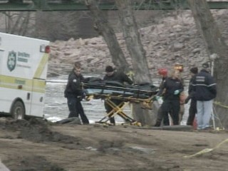 Divers Searching Foam Filled River for 2