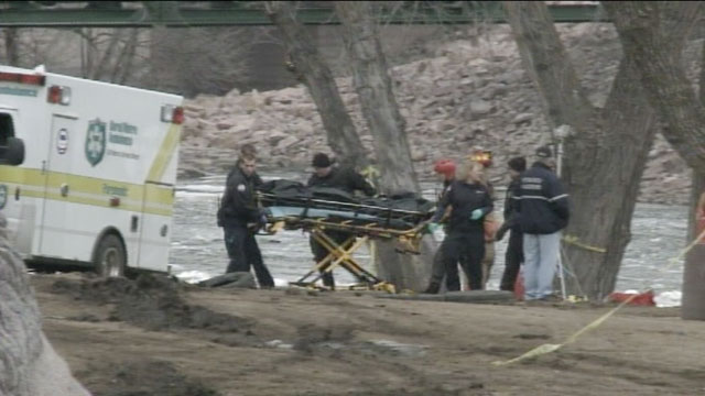 PHOTO: A body is recovered from a river in Sioux Falls, South Dakota, where a teenage girl and a man are missing after jumping into the icy waters to save a six-year-old boy on March 14, 2013.