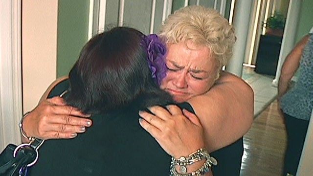 PHOTO: Sara Hudson and biological Kathleen Rhodes share a hug after being reunited. Rhodes who was forced into giving up the girl for adoption in 1977.
