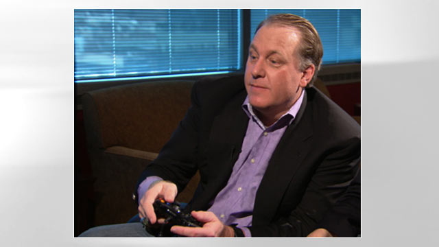 PHOTO: Former MLB star Curt Schilling test drives his companys first video game "Kingdoms of Amalur: Reckoning."