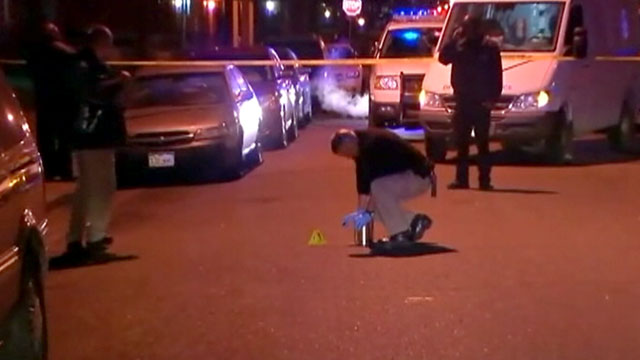 PHOTO: Police investigate the scene where four people were set on fire in Denver, Colo., Dec. 13, 2012.