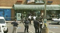 PHOTO A new soldier helping to attract others to the military was shot and killed outside the office Monday and a second soldier was wounded, and a suspect was arrested, police said.