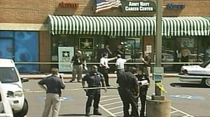 PHOTO A new soldier helping to attract others to the military was shot and killed outside the office Monday and a second soldier was wounded, and a suspect was arrested, police said.