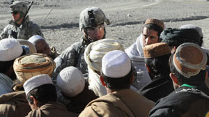 PHOTO Lieutenant Dave Womack, commander, 1st Battalion, 506th Infantry Regiment, 4th Brigade Combat Team, 101st Airborne Division, talks to men in the rural Paktika Province in southeastern Afghanistan
