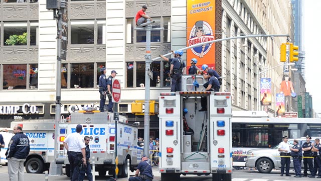 PHOTO: An unidentified man shut down a part of Times Square on June 28, 2011, after he climbed a light pole and refused to come down.