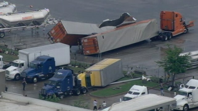 VIDEO: Flattened and crumpled trailers litter the area in the aftermath of twisters.